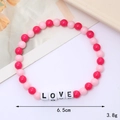 Detail of pink and magenta acrylic beaded LOVE bracelet with 6.5cm diameter and 3.8g weight - LOVE Style (Rose Red)