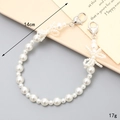 Elegant pearl bead phone charm strap with bow accents and heart-shaped lobster clasps - Hand Chain / Artificial Pearl Double Bow (K4367)