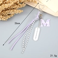 Detail of purple woven tassel keychain with marble M letter and heart-shaped metal clasp - Letter M (K4284)