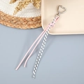Porte-clés avec cordon en cuir tressé en forme de cœur et fermoir à ressort argenté - Rose