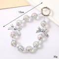Star-beaded phone charm with silver bows and spring clasp, 13cm length and 30g weight - Starry Sky Bead Pendant Silver