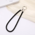 Detailed macro of black rhinestone wrist strap with sparkling luxury metal spring ring buckle - Black