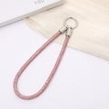 Elegant pink rhinestone phone wrist strap with silver metal ring on white display board - Pink