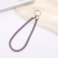 Detail of purple rhinestone braided lanyard with silver circular metal lobster clasp - Purple