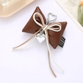 Brown leather bow keychain charm with heart pendant and silver carabiner clip - Cotton Filled Leather Bow Pendant Coffee (K4116)