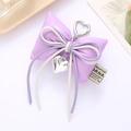 Chic purple faux leather bow keychain with heart pendant and silver spring clasp charm - Cotton Filled Leather Bow Pendant Purple (K4117)