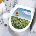 Detail of self-adhesive sunflower toilet lid sticker in a modern white bathroom decor - Sunflower Sea (M-50)