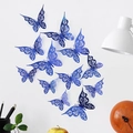 Close-up of laser-cut dark blue butterfly wall decor set on a clean white background - Blue