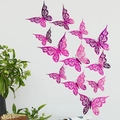 Detailed view of 12 pink purple hollow paper butterflies arranged on a minimalist white wall - Rose Red