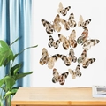 Detailed view of 12pcs golden 3D hollow butterfly wall stickers with intricate lace patterns - Champagne
