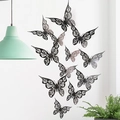 3D hollow black butterfly wall stickers with intricate laser-cut floral patterns on white wall - Black