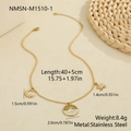 Detailed view of 18K gold stainless steel moon and star pendant necklace with zircons - 18K Gold / Gold (NMSN-M1510-1)