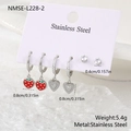 Detail view of stainless steel strawberry heart charms and zircon stud earrings set - Silver