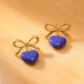 Detailed view of gold bowknot earrings with purple heart oil-dripping charms on gold fabric - 18K Gold / Purple