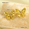 Macro detail of golden textured bow earrings with cubic zirconia on stone background - 18K Gold / Hammered Butterfly Style (NMSE-D534-1)