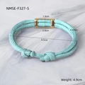 Close-up of light blue paracord bracelet featuring a golden magnetic clasp and woven knots - Light Blue
