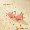 Macro shot of pink enamel dot stud earrings with 18K gold plating and size labels - Pink