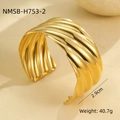 Detailed macro view of 2.9cm wide gold plated wavy cuff bracelet with vertical texture - Gold 3D Wave Texture Style (NMSB-H753-2)