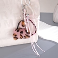 Ciondolo per borsa in peluche leopardato rosa con nastri e campanellino d'argento - Ciondolo Borsa Leopardato (K5888) / Rosa
