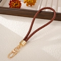 Handmade braided brown PU leather phone wrist strap with gold metal lobster clasp detail - Charm / Dark Brown