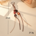 Detail view of woven leather bag charm with amber beads and silver spring clasp - K5948 Brown (Two Pendants Four Lines)