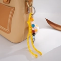 Detail of woven sports ball pendant featuring baseball and soccer beads on leather bag - Football + Woven Rope Pendant (K5920) / Yellow