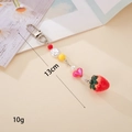 Detail view of handmade beaded keychain with strawberry charm measuring 13cm and 10g - 3D Strawberry