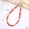Ciondolo per telefono con perline rosse e pendenti dorati a forma di sorriso e cuore - Stile Viso Sorridente Cristallo Rosso (K4267)
