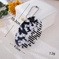 Detail shot of mini marbled comb with dimensions 10.3cm length and 7.2g weight info - Oval Comb (K5957)