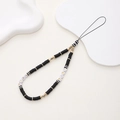 Detail of beaded phone strap with LOVE letter beads and black clay discs on white prop - Black Clay LOVE Style (K814)
