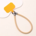 Short leather phone wrist strap with yellow patch and khaki cord on cloud board - Khaki