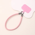 Close-up of pink leather phone wrist strap with durable metal rings and clear spacer pad - Pink