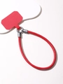 Detail view of red leather wrist strap and matching phone tether tab with gray buckle - Red