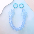 Close-up of blue mermaid bead phone strap with glowing bow details and frosted resin charms - Luminous Blue Bowknot Style (K2014)