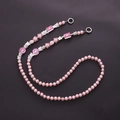Close-up of pink acrylic beads with silver butterfly charms and heart patterns - K1197 Pink