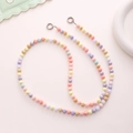Detail of candy-colored acrylic beads with striped texture and silver metal clasps - K1035 Pumpkin Bead Crossbody (Mixed Colors)