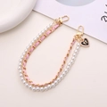 Pink leather chain and pearl phone lanyard with heart bow charm and golden lobster clasps - Leather Woven Pearl Heart Handheld Chain (K209) / Pink