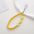 Close-up of yellow beaded phone strap featuring three bright wooden heart-shaped charms - K1150 Wooden Heart Phone Chain (Yellow)