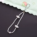 Detailed shot of white beaded phone strap featuring cloud pendants and gold spacers - White Cloud Style (K1815)