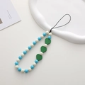 Detail of beaded phone strap with blue beads and green wooden hearts on a white tray - K1151 Wooden Heart Phone Chain (Dark Green)