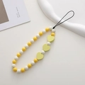 Detail of yellow and white beaded phone strap with heart-shaped wooden accents on a tray - K1153 Wooden Heart Phone Chain (White+Yellow)