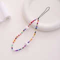 Colorful beaded phone wrist strap with white cloud charms on a minimalist white tray - Multicolor Cloud Style (K1812)