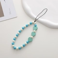 Detailed view of handmade beaded phone strap with blue white beads and green hearts - K1152 Wooden Heart Phone Chain (Light Green)