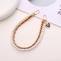 Dual-layer chain featuring white pearls and brown leather strap with heart pendant - Brown