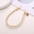 Dual-layer phone strap with white faux pearls and gold chain featuring a heart bow charm - Leather Woven Pearl Heart Handheld Chain (K208)
