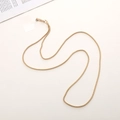 Close-up of golden woven metal chain strap with high-gloss swivel lobster clasps - K1659-4mm Gold Twist Chain
