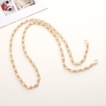 Detail of elegant gold metal chain strap with white pearls and lobster clasps - K1967 Long Artificial Pearl Woven Chain