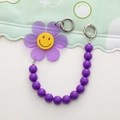 Acryl zonnebloem en smiley telefoonriempje met paarse kralen en metalen sluitingen - Paars Zonnebloem Ketting