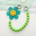 Groene acryl zonnebloem telefoonkoord met geel lachend gezicht en kralenketting hanger - Groen Zonnebloem Ketting