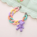 Close-up of matte colorful acrylic ring chain and purple 3D bear pendant jewelry - Bracelet Style / Purple Bear Wristlet with Screws (K121)